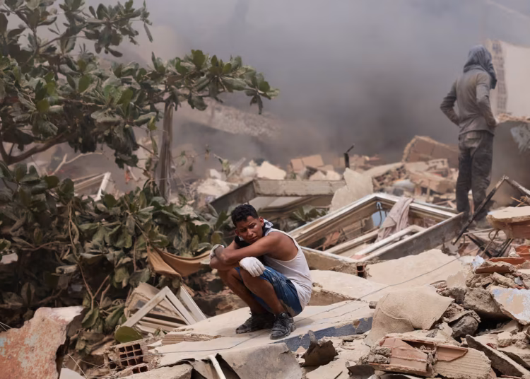  Man walks through rubble of collapsed building in La Guaira Venezuela after doublet earthquake June 2026